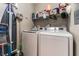 Laundry room features modern appliances and ample storage shelves at 3609 Indigo Flower St # 1, North Las Vegas, NV 89084