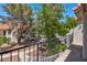 Balcony view featuring mature trees and landscaping, enhancing the property's appeal and providing a serene outdoor space at 3609 Melonies Dr # 93, Las Vegas, NV 89103