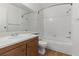 Bright bathroom featuring a shower and tub combination with a white sink and a wooden vanity at 3609 Melonies Dr # 93, Las Vegas, NV 89103