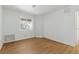 Bright bedroom featuring hardwood floors, white walls, and a window for natural light at 3609 Melonies Dr # 93, Las Vegas, NV 89103