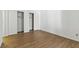 Bedroom featuring hardwood floors, white walls and doors, and a sliding door closet at 3609 Melonies Dr # 93, Las Vegas, NV 89103