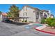 Condo building exterior features covered parking, desert landscaping, and a stucco finish, complemented by red tile roofs at 3609 Melonies Dr # 93, Las Vegas, NV 89103