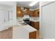 Functional kitchen features white countertops, stainless steel appliances, and light wood cabinets, complemented by hardwood flooring at 3609 Melonies Dr # 93, Las Vegas, NV 89103
