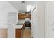 Traditional kitchen featuring stainless steel appliances and wood-grain cabinets and a breakfast bar at 3609 Melonies Dr # 93, Las Vegas, NV 89103