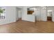 Open-concept living area with hardwood floors, complemented by natural light and view into adjacent kitchen area at 3609 Melonies Dr # 93, Las Vegas, NV 89103