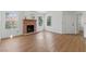 Spacious living room features wood-look flooring, brick fireplace, and ample natural light, perfect for entertaining at 3609 Melonies Dr # 93, Las Vegas, NV 89103