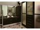 Bathroom featuring double vanity, a modern closet, and warm lighting at 3750 Las Vegas Blvd # 4303, Las Vegas, NV 89158