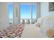 Bedroom with a colorful quilt and views of city and mountains at 3750 Las Vegas Blvd # 4303, Las Vegas, NV 89158
