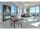 Modern office space with city views, a sleek desk, and contemporary artwork on display at 3750 Las Vegas Blvd # 4303, Las Vegas, NV 89158