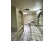 Well-lit bathroom with custom vanity, ample storage, and tiled countertops at 3797 Monument St, Las Vegas, NV 89121
