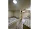 Elegant bathroom with a large tub, built-in shelving, and ample vanity space at 3797 Monument St, Las Vegas, NV 89121