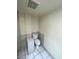 Compact bathroom featuring a toilet and tiled walls at 3797 Monument St, Las Vegas, NV 89121