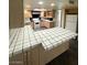 Open kitchen with bright countertops and wooden cabinets, great for Gathering time at 3797 Monument St, Las Vegas, NV 89121