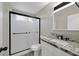Modern bathroom with sleek black fixtures and frosted glass shower door at 3849 Boca Chica Ave, Las Vegas, NV 89120