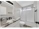 Modern bathroom features a granite countertop and sleek sliding glass shower door at 3849 Boca Chica Ave, Las Vegas, NV 89120