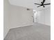 Bright bedroom featuring plush gray carpeting and a contemporary ceiling fan at 3849 Boca Chica Ave, Las Vegas, NV 89120