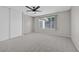 Neutral bedroom featuring carpeted floor and a large sliding door closet at 3849 Boca Chica Ave, Las Vegas, NV 89120