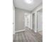 Well-lit hallway with durable wood flooring, providing easy access to other rooms at 3849 Boca Chica Ave, Las Vegas, NV 89120