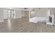 Spacious living room featuring wood flooring, fireplace and open layout at 3849 Boca Chica Ave, Las Vegas, NV 89120