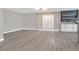 Bright open living room with wood flooring, neutral walls, and access to a sliding glass door at 3849 Boca Chica Ave, Las Vegas, NV 89120
