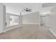 Open living room featuring wood flooring, fireplace and gray walls at 3849 Boca Chica Ave, Las Vegas, NV 89120