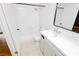 Bright bathroom features a shower-tub combination with white tiling and a modern vanity with a sleek countertop at 4205 Thicket Ave, North Las Vegas, NV 89031
