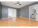 Bedroom with hardwood floors, sliding glass door, and attached bathroom at 4205 Thicket Ave, North Las Vegas, NV 89031