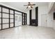 Spacious living room with built-in shelving, fireplace, and sliding glass doors at 4205 Thicket Ave, North Las Vegas, NV 89031