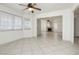 Open floor plan living room with tile floors, lots of windows, and natural lighting at 4205 Thicket Ave, North Las Vegas, NV 89031