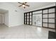 Bright living room featuring built-in shelving and sliding glass doors at 4205 Thicket Ave, North Las Vegas, NV 89031