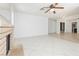 Spacious living room with tile floors and a cozy brick fireplace at 4205 Thicket Ave, North Las Vegas, NV 89031