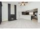 Bright, open living space with tile flooring, a modern fireplace, and a view of the kitchen at 4205 Thicket Ave, North Las Vegas, NV 89031