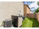 Artificial turf backyard with AC unit, exterior storage, and a privacy fence at 4249 Fleet Dancer St, Las Vegas, NV 89129