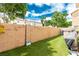 Artificial turf in backyard enclosed by a block wall and string lighting at 4249 Fleet Dancer St, Las Vegas, NV 89129