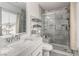 Bright bathroom with stylish marble tile in shower and vanity at 4249 Fleet Dancer St, Las Vegas, NV 89129
