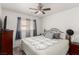 Comfortable bedroom featuring a ceiling fan, a bed with a quilt, and a TV at 4249 Fleet Dancer St, Las Vegas, NV 89129
