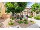 Charming home with a tidy landscaped yard, a tree, and a blue front door at 4249 Fleet Dancer St, Las Vegas, NV 89129