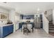 Charming kitchen features stainless steel appliances and stylish blue cabinets at 4249 Fleet Dancer St, Las Vegas, NV 89129