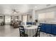 Open floor plan with a kitchen featuring blue cabinets and a spacious living area at 4249 Fleet Dancer St, Las Vegas, NV 89129