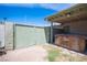 Backyard features a covered hot tub, privacy gate, and exterior door at 4409 Rosebank Cir, Las Vegas, NV 89108