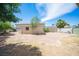 Large backyard featuring a storage shed and partial landscaping, offering room for gardening and activities at 4409 Rosebank Cir, Las Vegas, NV 89108
