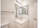 Bathroom with a sink, mirror, and updated flooring at 4409 Rosebank Cir, Las Vegas, NV 89108