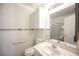 Neutral bathroom with vanity, toilet, and glass shower, all in white at 4409 Rosebank Cir, Las Vegas, NV 89108