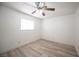 Bright bedroom with a ceiling fan and updated flooring at 4409 Rosebank Cir, Las Vegas, NV 89108
