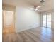 Bedroom featuring a sliding glass door, wood-look flooring, and a ceiling fan at 4409 Rosebank Cir, Las Vegas, NV 89108