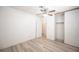 Bedroom with large closet, ceiling fan, and updated flooring at 4409 Rosebank Cir, Las Vegas, NV 89108