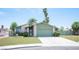 Charming single-story home featuring a well-manicured lawn and an attached two-car garage at 4409 Rosebank Cir, Las Vegas, NV 89108