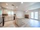 Well-lit kitchen with an island, stainless appliances, and access to the backyard patio at 4409 Rosebank Cir, Las Vegas, NV 89108