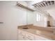 Bathroom sink features a wooden countertop and mirror at 4409 Rosebank Cir, Las Vegas, NV 89108