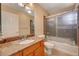 Bathroom featuring a vanity with a sink, marble countertop, and a shower-tub combination at 4535 Mission Meadow Cir, Las Vegas, NV 89139